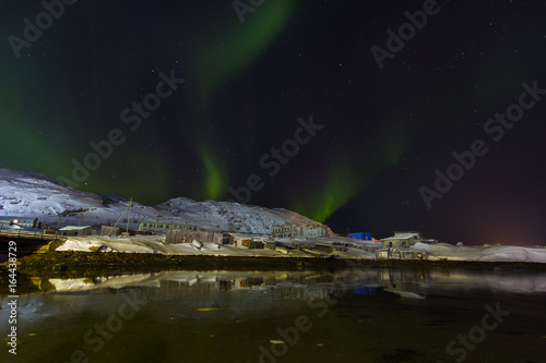 Green Aurora borealis on Teriberka in Murmansk region, Russia
