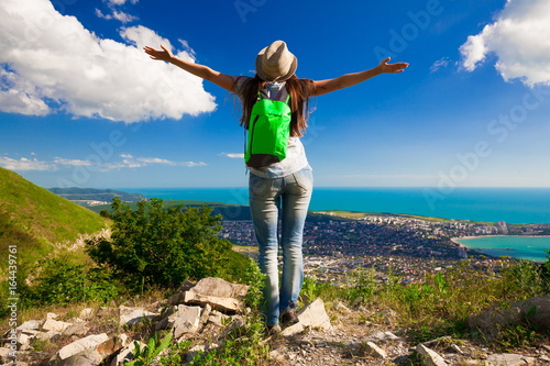 Mountain sea summer. Back. Jeans and shirt