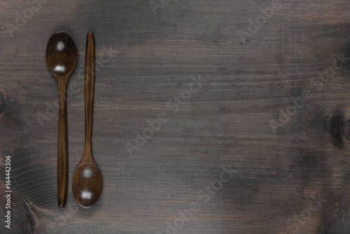 Wooden spoons on a dark woo...