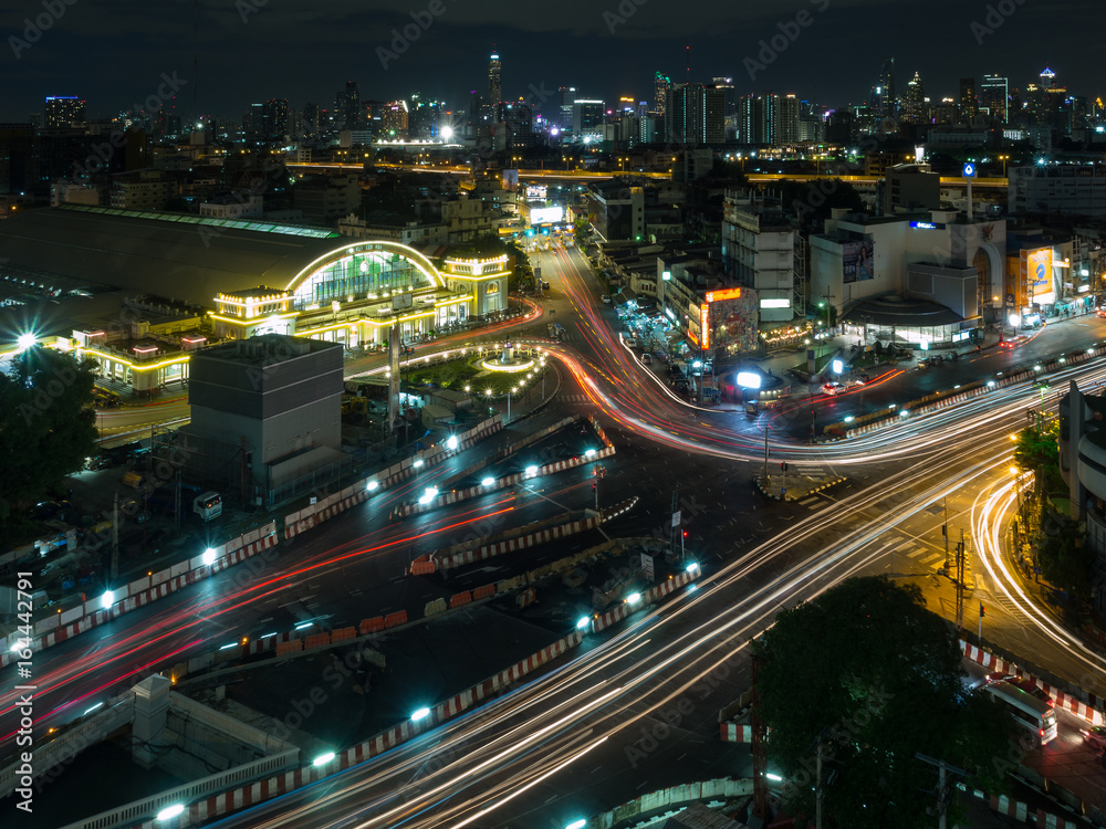 Bangkok train station known as Hualampong cityscape with vehicle light trails in the night