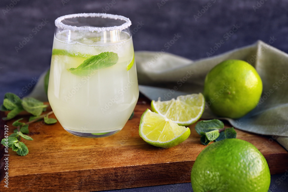 Delicious margarita cocktail on wooden board Delicious margarita cocktail on wooden board
