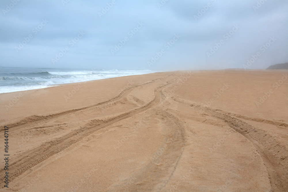Storm and deserted beach of the ocean in Portugal, Atlantic