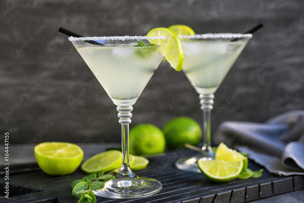 Delicious margarita cocktail on wooden board Delicious margarita cocktail on wooden board
