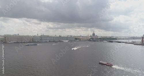 Aerial low altitude back fly over St. Petersburg neva with view of Stock Market Square and Saint Isaac's Cathedral in summer day photo