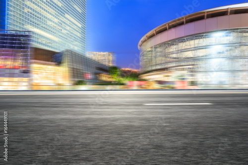 Motion blur asphalt road and modern buildings in Shanghai