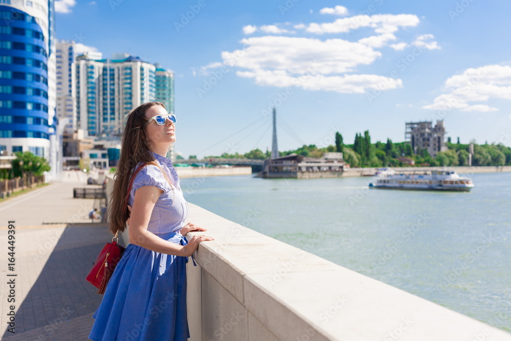  Woman in blue skirt and shirt, river, fun