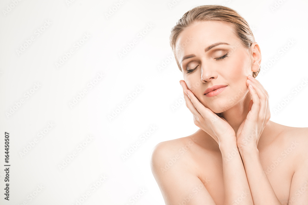 Mature woman beauty health care isolated on white Mature woman beauty health care isolated on white