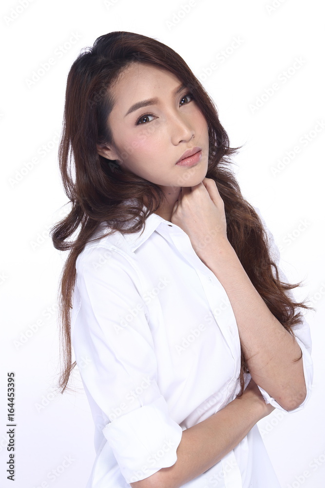 Perfect Healthy Female Model with Natural Beauty Clean Look Fashion Make Up style in White Shirt, long hair, White Background in Studio Lighting, the concept of health, smile Face Perfect Healthy Female Model with Natural Beauty Clean Look Fashion Make Up style in White Shirt, long hair, White Background in Studio Lighting, the concept of health, smile Face