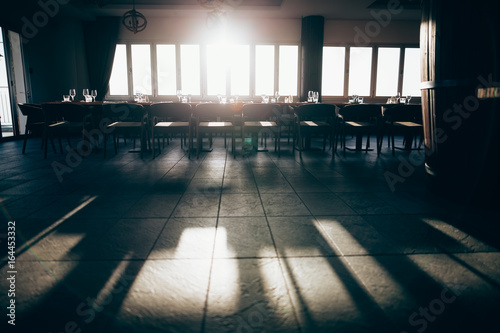 Interior of empty restaurant on sunny day