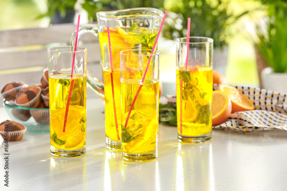 Glassware with refreshing lemonade on table outdoor Glassware with refreshing lemonade on table outdoor