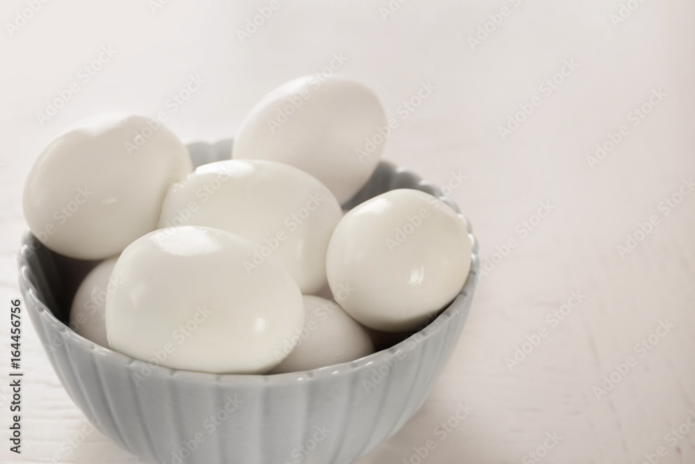 Bowl with hard boiled eggs on light background. Nutrition concept Bowl with hard boiled eggs on light background. Nutrition concept