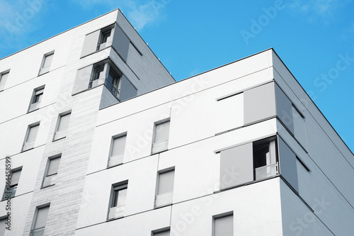 Modern building with windows on sky background