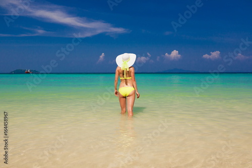 Thailand. Woman sea, bikini, hat, back. Sea background + ОЛЕГ-2
