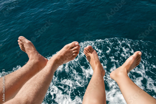 Bare feet men and women over the sea