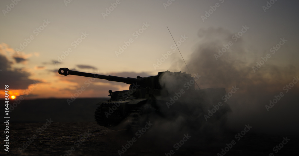 War Concept. Military silhouettes fighting scene on war fog sky background, World War German Tanks Silhouettes Below Cloudy Skyline At night. Attack scene. Armored vehicles. Tanks battle scene
