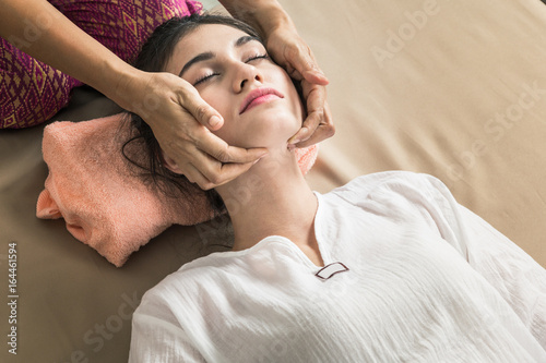 Young Girl get Thai style massage by Woman for body therapy