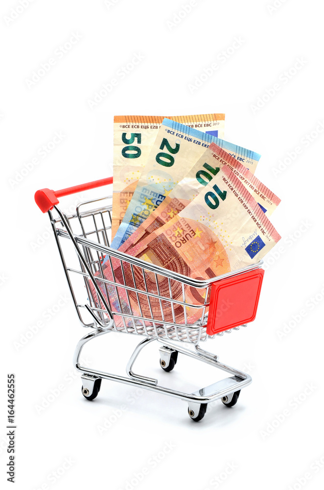 shopping cart with many euros on white background