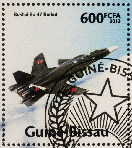 Supersonic jet fighter Sukhoi Su-47 Berkut on postage stamp