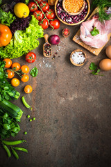 Meat cheese beans and vegetables on dark stone table. Healthy food ingredient.