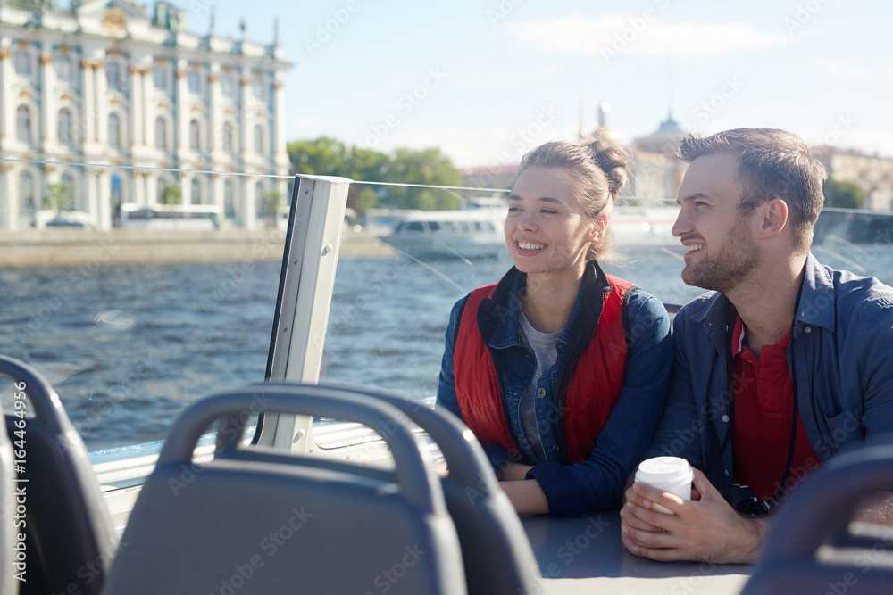 Urban lovers on motor-boat enjoying their honeymoon