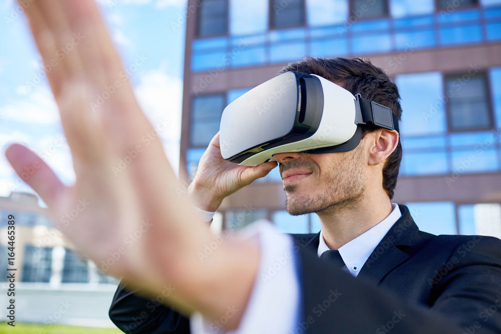 Young man with virtual reality headset in urban environment Young man with virtual reality headset in urban environment