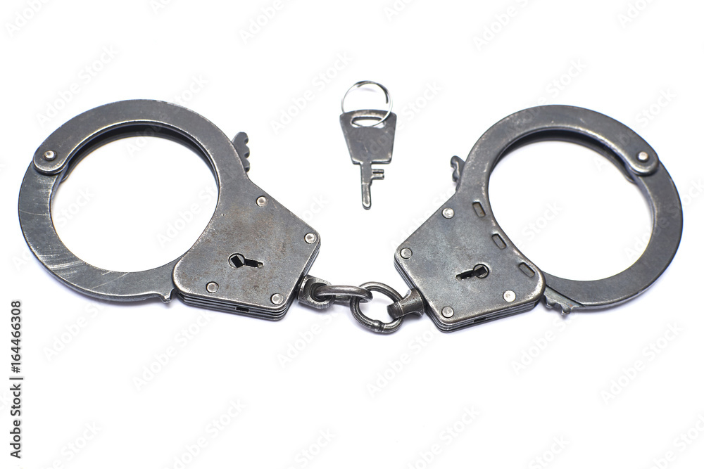 Obraz premium pair of handcuffs close-up on a white background