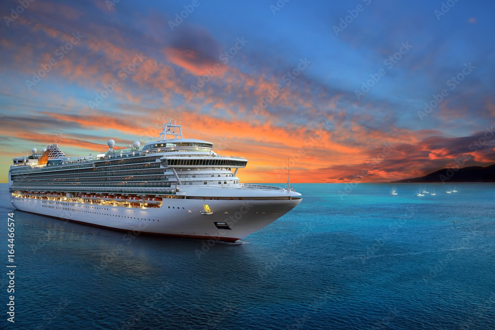 Fototapeta premium Luxury cruise ship sailing to port on sunrise 