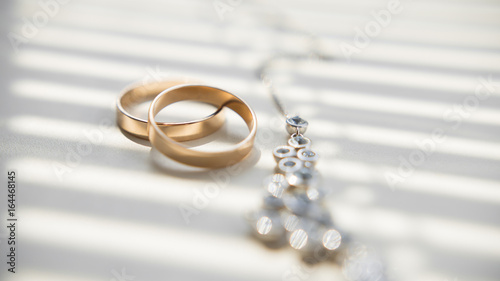 Golden wedding rings and juvelery, macro photo