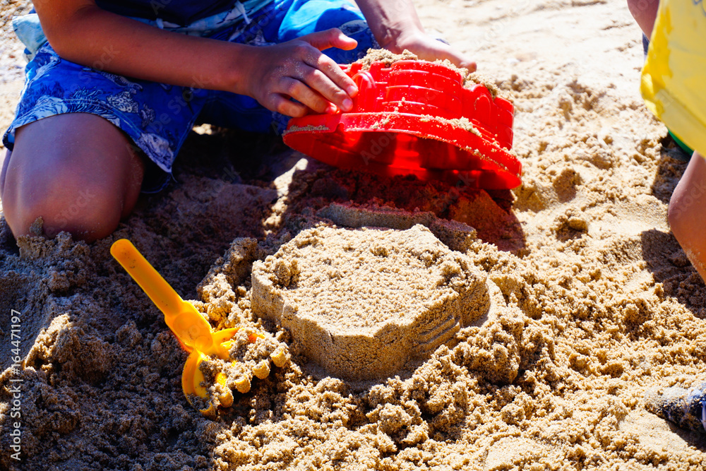childs are playing game at the beach, close up childs are playing game at the beach, close up