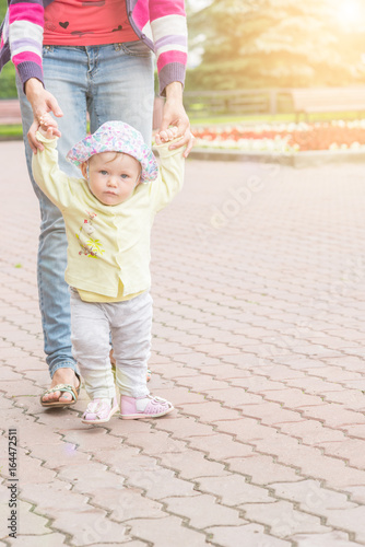Baby first steps with mom