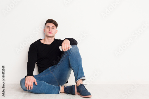 Young man portrait at white studio background.
