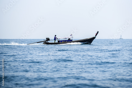 Long tail boat sailing on Andaman sea  Krabi Thailand.