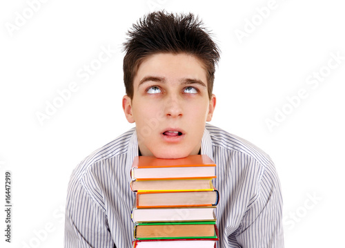 фотографія Tired Teenager with a Books