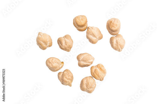 Some spread out chickpeas on white background seen from above photo