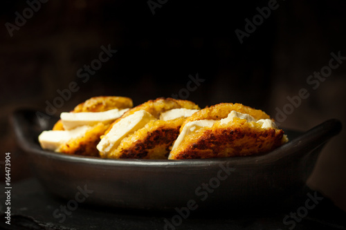 Traditional Colombian Arepa de Choclo Preparation : Arepas de choclo filled with white cheese