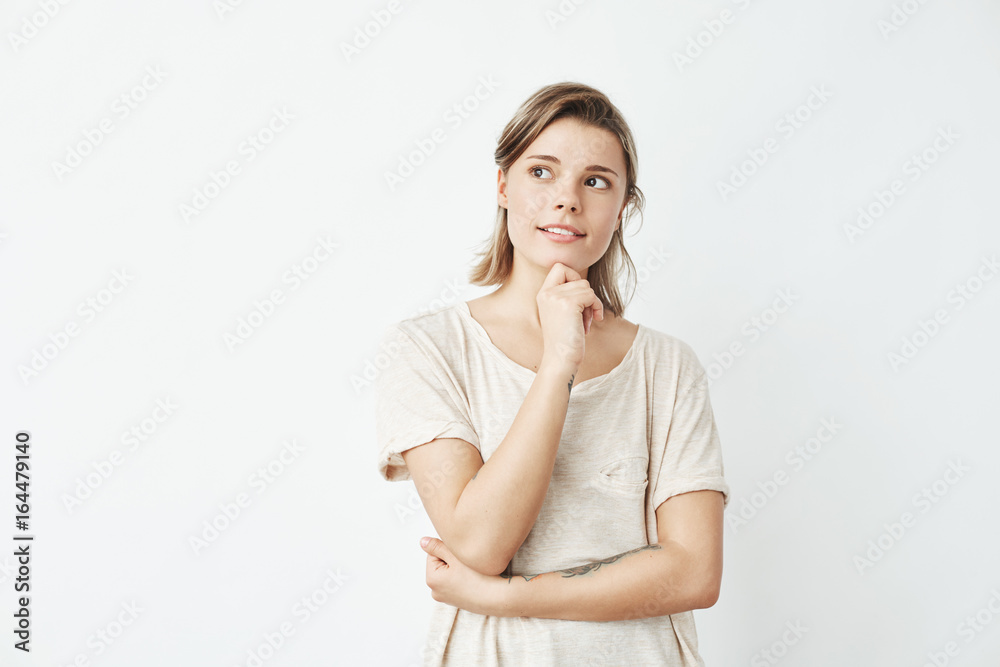 Young beautiful girl dreaming thinking looking in side over white background. Young beautiful girl dreaming thinking looking in side over white background.