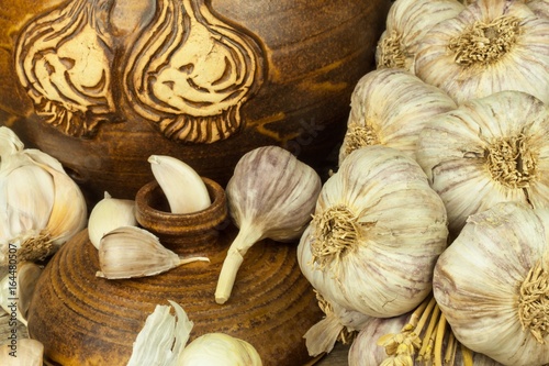 Garlic on a wooden table. Healthy food. Home flu treatment. Aromatic spices.