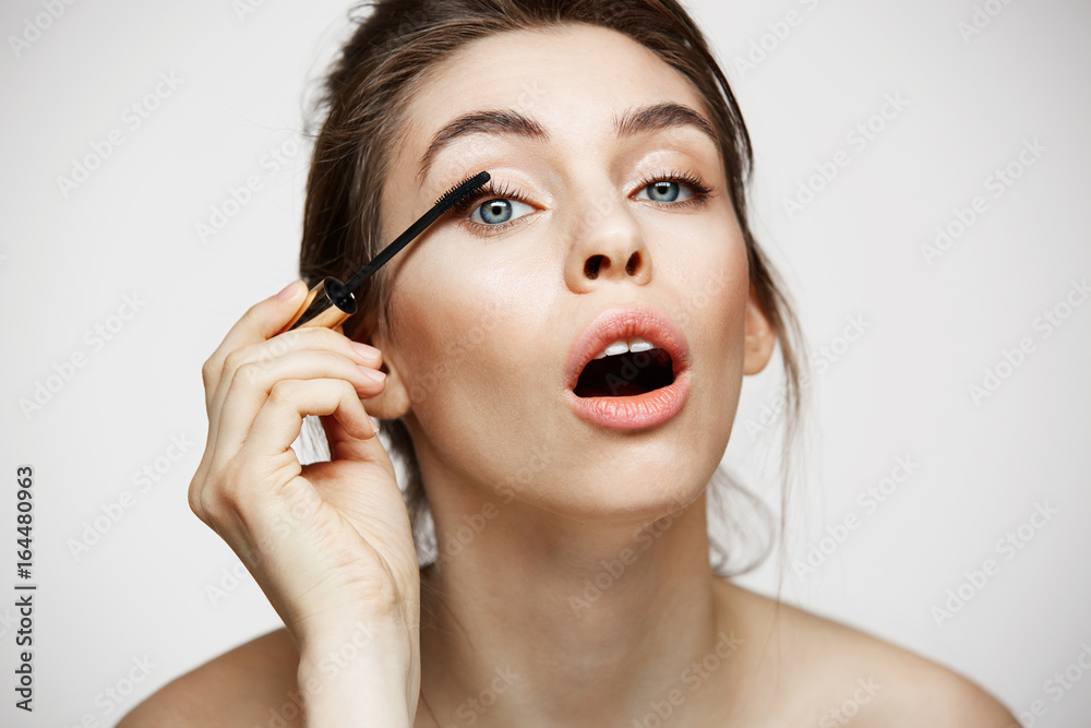 Funny beautiful girl
dye eyelashes with opened mouth looking at camera over white background. Beauty health and cosmetology concept. Funny beautiful girl
dye eyelashes with opened mouth looking at camera over white background. Beauty health and cosmetology concept.