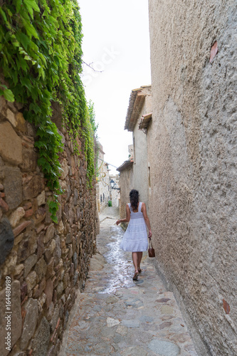 Beautiful woman on the background of the old city