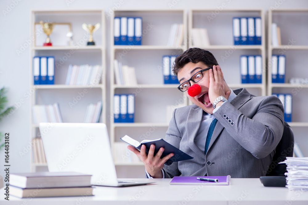 Clown businessman working in the office Clown businessman working in the office