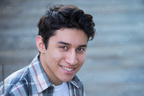 Teenage Hispanic boy, smiling 