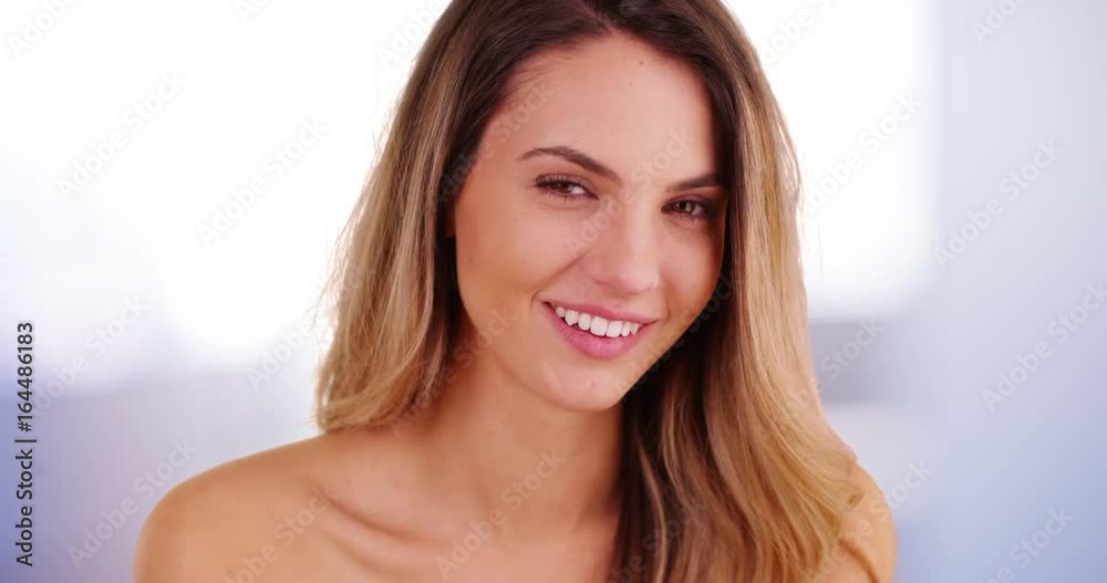 Closeup of beautiful young woman indoors, looking at camera with flirty expression. Close up of feminine Caucasian millennial, smiling at camera inside room. 4k Closeup of beautiful young woman indoors, looking at camera with flirty expression. Close up of feminine Caucasian millennial, smiling at camera inside room. 4k
