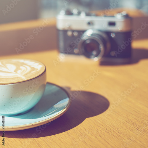 drink background of morning coffey in cafe at sunny day with analog camera on table