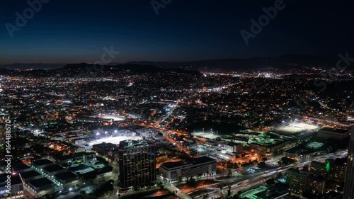 Aerial Time Lapse of Los Angeles Downtown Skyscrapers and Traffic at Night photo