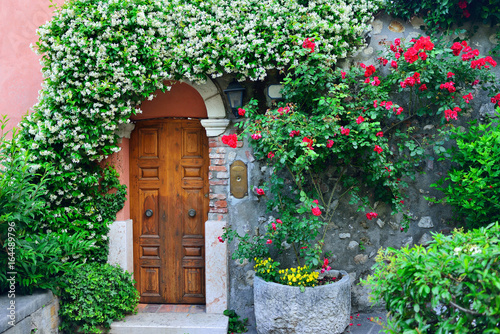 Old door with flowers in Verona, Italy