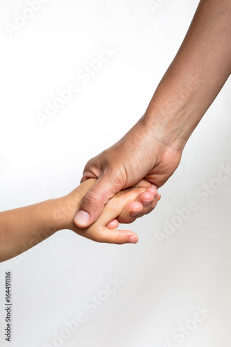 Close up of a woman s hand holding a child s hand