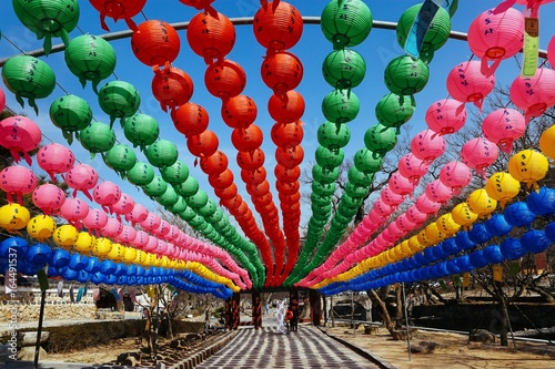 Tela Colorful lanterns lining a walkway at a monastery in South Korea