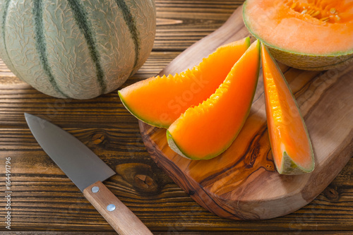 Cantaloupe melon on wooden background