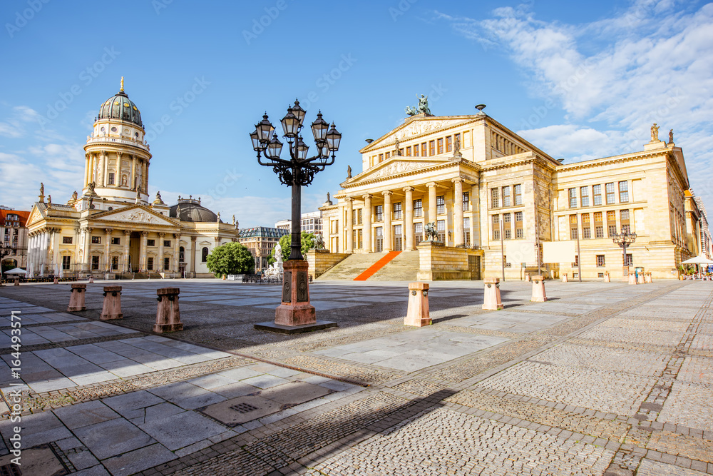 Viiew on the Gendarmenmarkt square with concert house building and German cathedral during the morning light in Berlin city - obrazy, fototapety, plakaty 