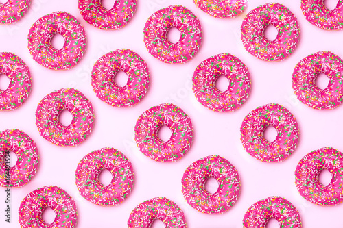 isometric. Pink donut pattern on a pink background